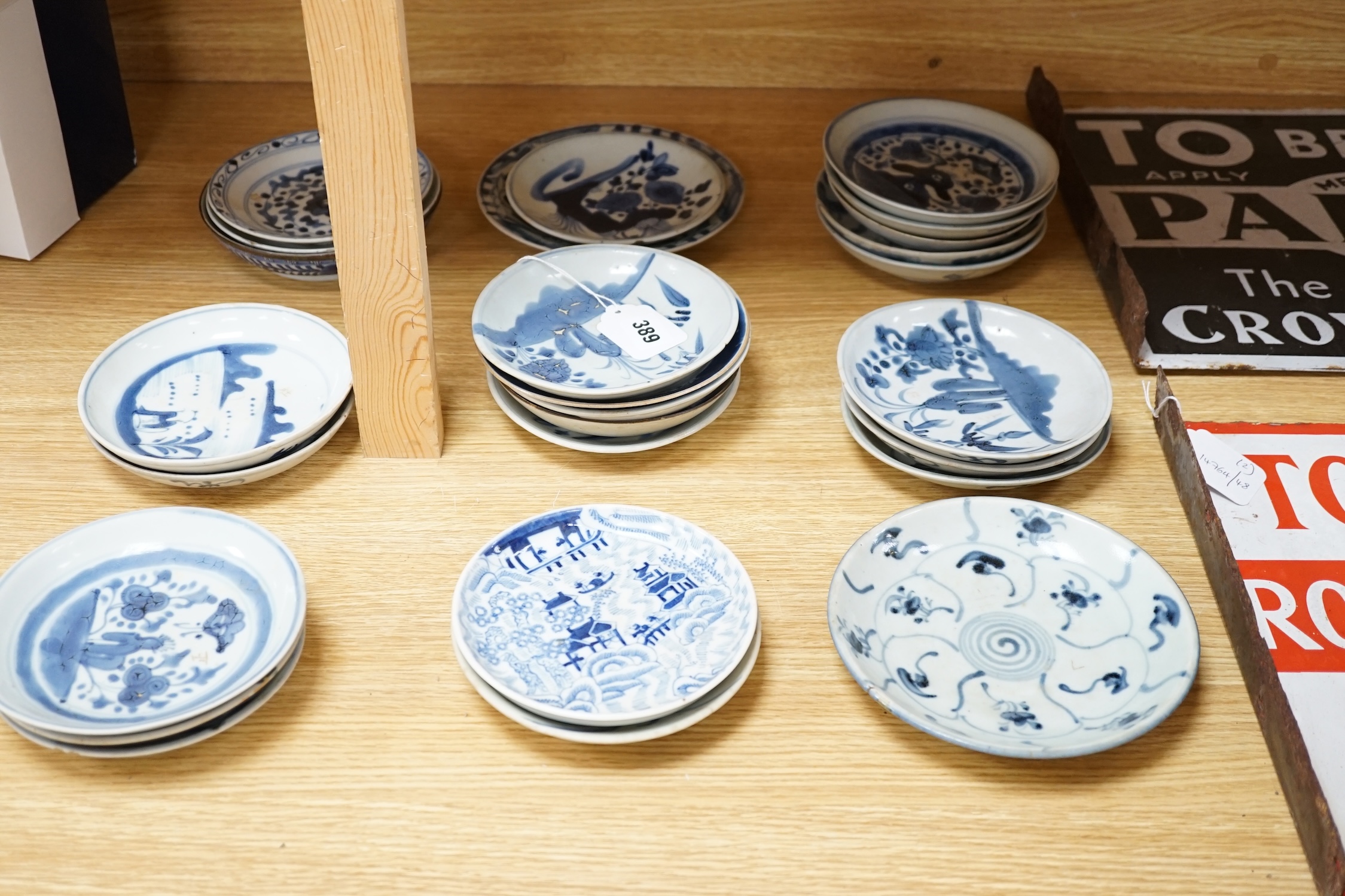 A group of 18th/19th century Chinese blue and white saucers and shallow dishes, largest 18cm in diameter. Condition - varies, mostly fair